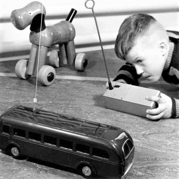 boy with rc bus toy