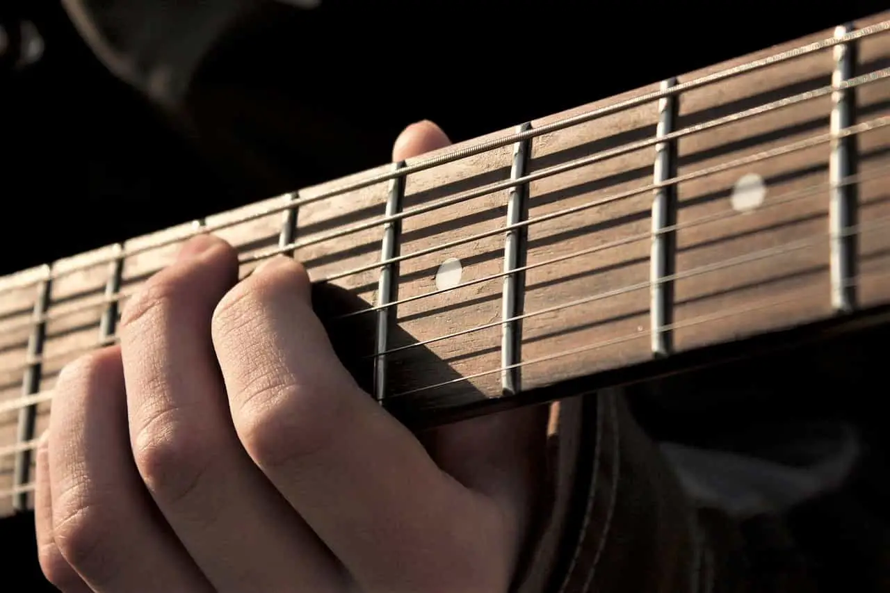 close up guitar left hand